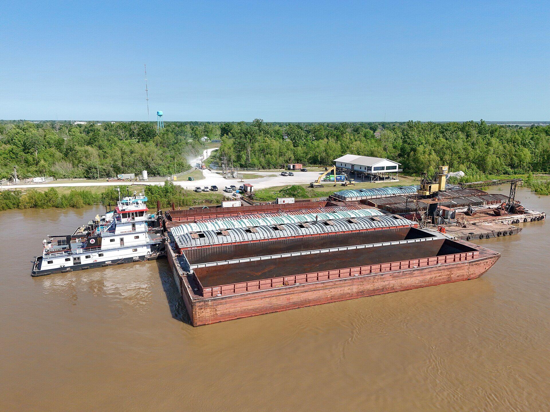 Aerial view of barges being loaded at a Mississippi River dock