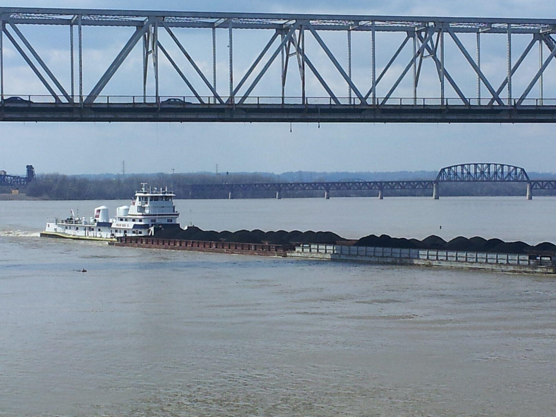 Tugboat pushing barges on the river